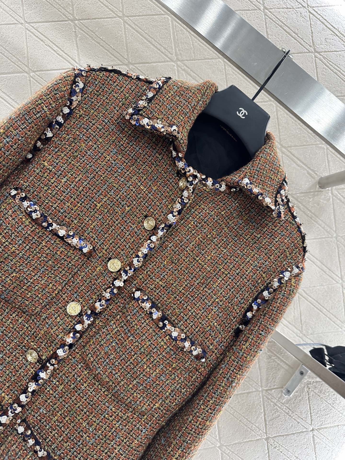 Lapel and belted dress jacket with beaded hem