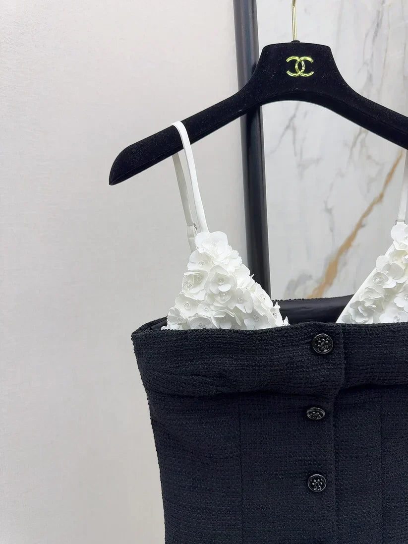 White floral top with black suspenders Vest