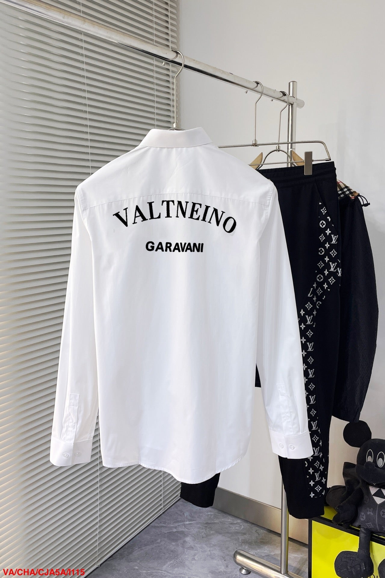 shirt with embroidered letters on chest