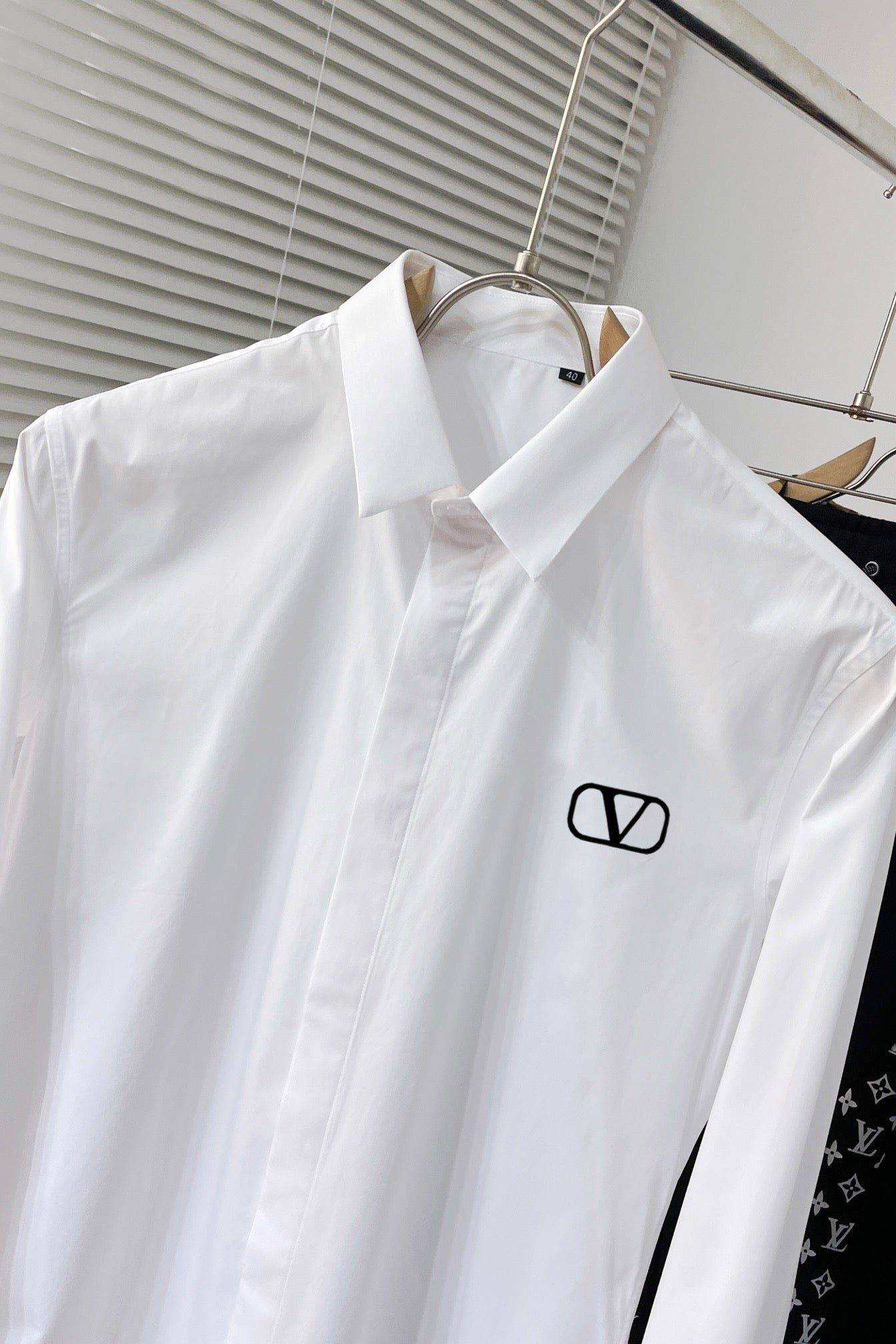 shirt with embroidered letters on chest