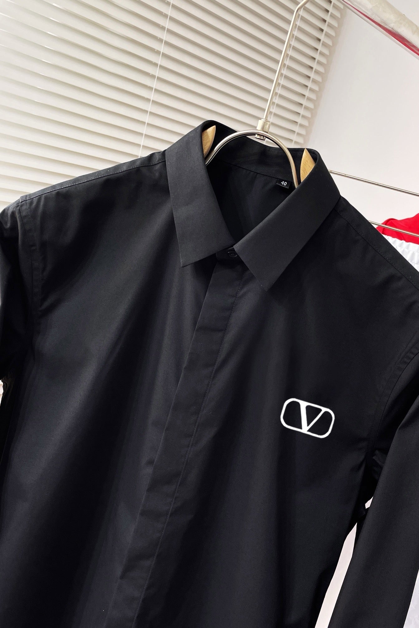 shirt with embroidered letters on chest