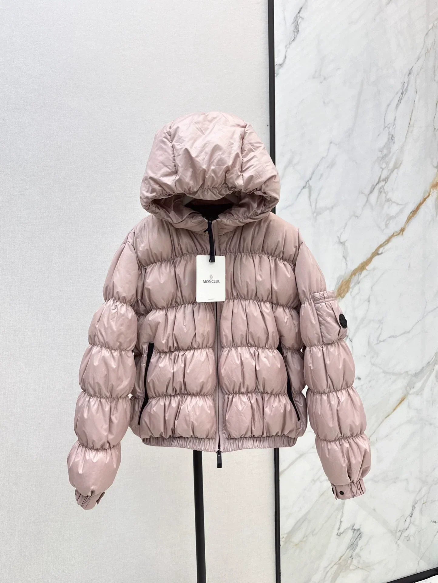 25 Pleated decorative hooded down jacket
