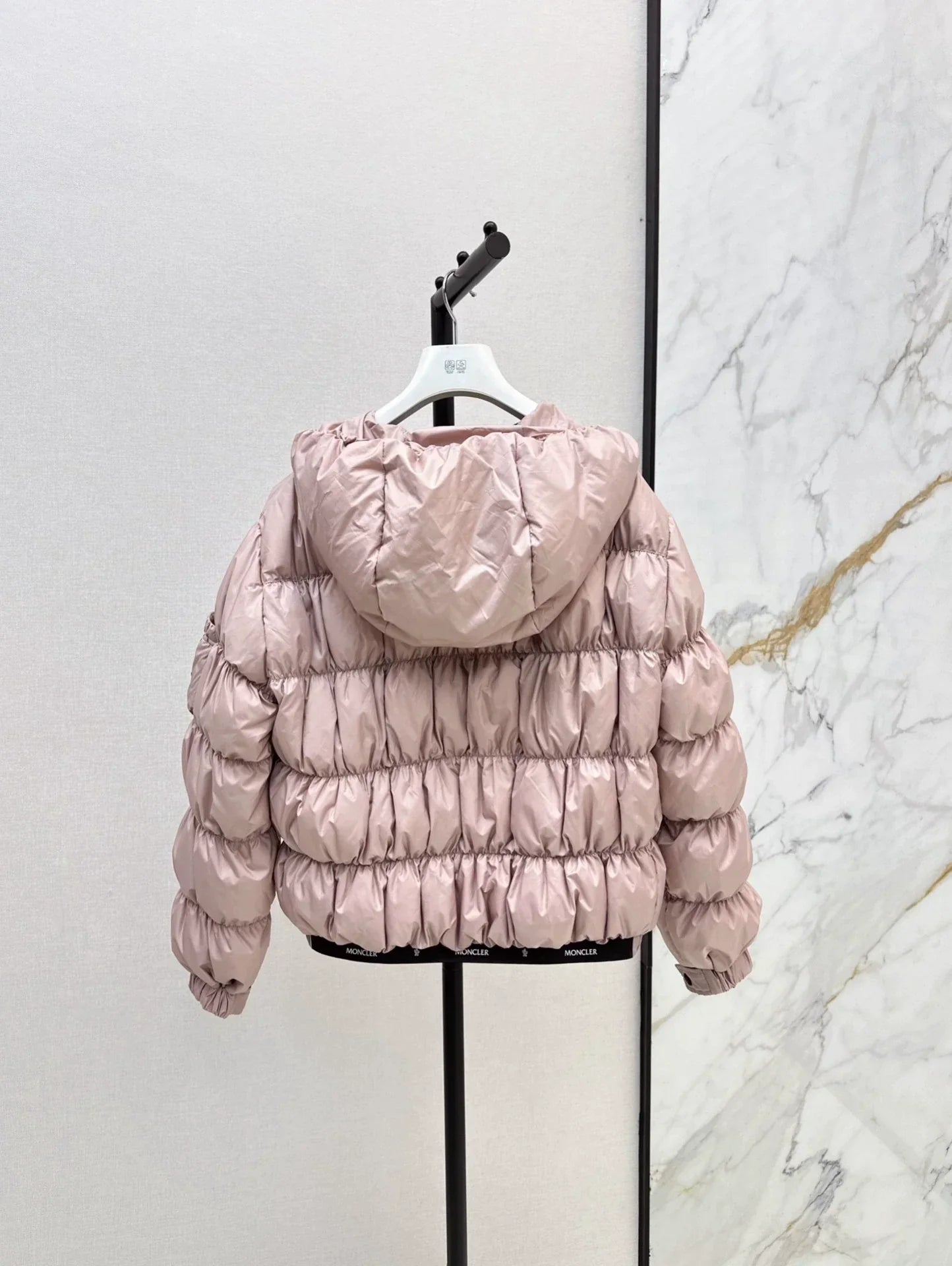 25 Pleated decorative hooded down jacket
