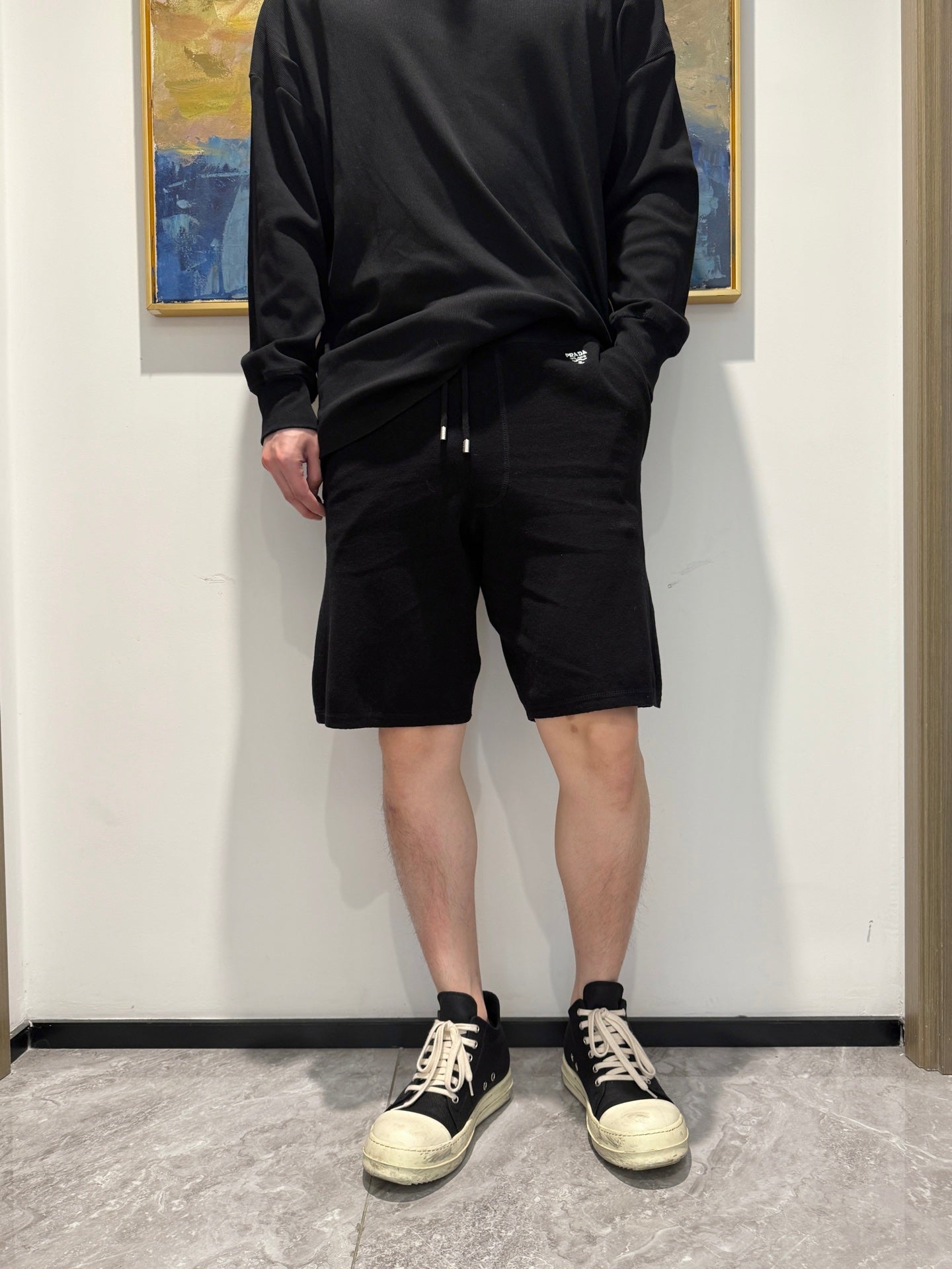 P 25 Embroidered drawstring shorts with small label on the back pocket