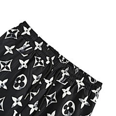 25fw distressed mottled monogram print trousers