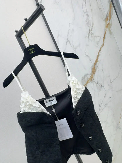 White floral top with black suspenders Vest