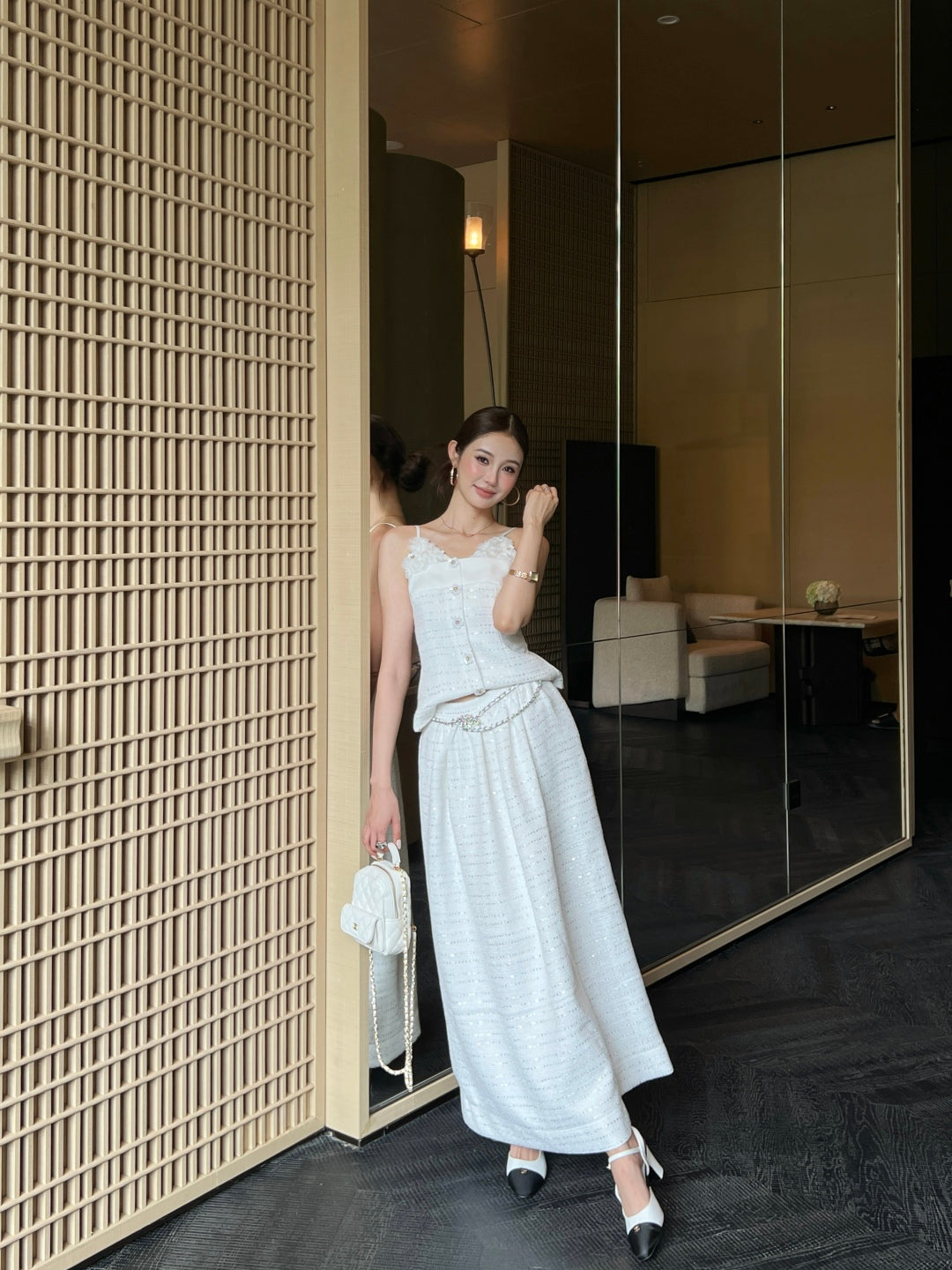 C 25 High-waisted pleated skirt with waist chain